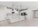 Well-equipped kitchen featuring white cabinets, stainless steel appliances, a center island, and ample counter space at 2431 Tudor Rose Dr, Sanford, FL 32773