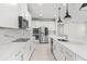 Bright kitchen featuring stainless steel appliances, white cabinets, and ample counter space, perfect for cooking at 2431 Tudor Rose Dr, Sanford, FL 32773