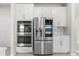 Modern kitchen with stainless appliances, a double oven, white cabinets, and plenty of countertop prep space at 2431 Tudor Rose Dr, Sanford, FL 32773