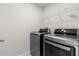 Laundry room with stainless steel, front-loading washer and dryer at 2431 Tudor Rose Dr, Sanford, FL 32773