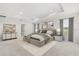 Spacious main bedroom with tray ceiling and decor, plus adjoining bathroom at 2431 Tudor Rose Dr, Sanford, FL 32773