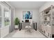 Well-lit home office with a desk, chair, shelving, and a window providing natural light and neighborhood views at 2431 Tudor Rose Dr, Sanford, FL 32773