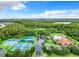 Aerial view of community amenities including pool, tennis courts, and clubhouse at 2451 Strandhill St, Orlando, FL 32824