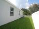 Side yard with well-manicured lawn and privacy fence at 2451 Strandhill St, Orlando, FL 32824