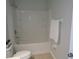 Bathroom featuring a white bathtub with wall paneling at 2451 Strandhill St, Orlando, FL 32824