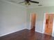 Spacious bedroom with hardwood floors and access to both a closet and en-suite bathroom at 2451 Strandhill St, Orlando, FL 32824