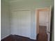A closet with doors that is next to an entrance and has hardwood floors at 2451 Strandhill St, Orlando, FL 32824