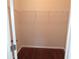 A standard reach-in closet features a rod and shelf for efficient storage solutions at 2451 Strandhill St, Orlando, FL 32824