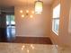 Open dining area view, with kitchen counter overlooking at 2451 Strandhill St, Orlando, FL 32824