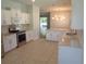 Open-concept kitchen with stainless steel appliances and spacious countertops at 2451 Strandhill St, Orlando, FL 32824