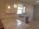 Bright kitchen featuring granite countertops, stainless steel appliances, and tile backsplash at 2451 Strandhill St, Orlando, FL 32824