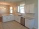 Kitchen featuring stainless steel appliances, granite countertops, and white cabinets at 2451 Strandhill St, Orlando, FL 32824