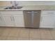 Kitchen featuring a stainless steel dishwasher and white cabinets at 2451 Strandhill St, Orlando, FL 32824