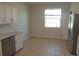 Eat-in kitchen boasts a stainless steel refrigerator and a bright window view at 2451 Strandhill St, Orlando, FL 32824