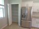 Kitchen includes a stainless steel refrigerator and pantry storage at 2451 Strandhill St, Orlando, FL 32824
