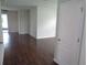 Bright and open living room with hardwood floors and neutral paint at 2451 Strandhill St, Orlando, FL 32824