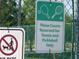 Tennis and pickleball court rules posted on fence at 2451 Strandhill St, Orlando, FL 32824