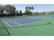 Community tennis courts surrounded by fence and landscaping at 2451 Strandhill St, Orlando, FL 32824
