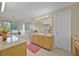 Bright bathroom with dual sinks, a soaking tub, and a glass-enclosed shower at 2487 River Tree Cir, Sanford, FL 32771