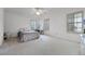 Light-filled bedroom with shuttered windows, ceiling fan, and a cozy desk/vanity area at 2487 River Tree Cir, Sanford, FL 32771