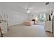 Spacious bedroom featuring double closets, a ceiling fan, and a vanity area at 2487 River Tree Cir, Sanford, FL 32771