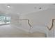 Hallway featuring a staircase and French doors opening to the outside at 2487 River Tree Cir, Sanford, FL 32771