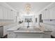 Spacious kitchen with a large island, stainless steel appliances, and ample cabinet space at 2487 River Tree Cir, Sanford, FL 32771
