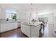 Bright kitchen featuring white cabinets, a center island, and stainless steel appliances at 2487 River Tree Cir, Sanford, FL 32771