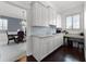 Bright kitchen with white cabinets, granite countertops, and modern appliances at 2487 River Tree Cir, Sanford, FL 32771
