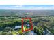 Aerial view showcasing a highlighted parcel of land with potential for new construction amid established homes at 2487 River Tree Cir, Sanford, FL 32771