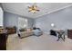 Comfortable living room featuring a sofa, desk, and cozy decor at 2487 River Tree Cir, Sanford, FL 32771