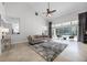 Living room showcases views to the pool area through expansive windows and glass doors at 2487 River Tree Cir, Sanford, FL 32771