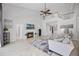 Cozy living room with a fireplace and views of the staircase offers a comfortable gathering space at 2487 River Tree Cir, Sanford, FL 32771