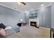 Cozy living room featuring a fireplace, plush seating, and a television at 2487 River Tree Cir, Sanford, FL 32771