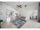 Bright living room features high ceilings, stylish furniture, staircase and a seamless open floor plan at 2487 River Tree Cir, Sanford, FL 32771
