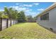 Wide shot of a private fenced backyard with healthy grass and ample space at 2603 E Marks St, Orlando, FL 32803