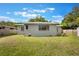 Spacious backyard featuring lush green grass and mature trees at 2603 E Marks St, Orlando, FL 32803
