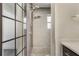 Modern bathroom featuring a walk-in shower with dual shower heads and gray tiling at 2603 E Marks St, Orlando, FL 32803