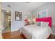 Bright bedroom featuring stylish decor, hardwood floors, and ample natural light at 2603 E Marks St, Orlando, FL 32803