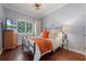 Charming bedroom with hardwood floors and a cozy bedside table at 2603 E Marks St, Orlando, FL 32803