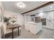 Well-designed kitchen features a central island, stainless steel appliances, and an adjacent dining area at 2603 E Marks St, Orlando, FL 32803