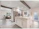 Bright kitchen features a large island, stainless steel appliances, and open layout to the living area at 2603 E Marks St, Orlando, FL 32803