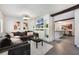 Open-concept living room with a modern design, recessed lighting, and seamless flow to the kitchen at 2603 E Marks St, Orlando, FL 32803