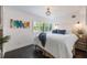 Inviting main bedroom features warm lighting, plush bedding, and stylish decor at 2603 E Marks St, Orlando, FL 32803