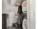 Organized walk-in closet with custom shelving, dark floors and built-in dresser in this home at 2603 E Marks St, Orlando, FL 32803