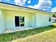 The backyard features a concrete patio and green grass at 2645 Sw 155Th Ln, Ocala, FL 34473