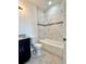 Modern bathroom featuring granite vanity, sleek toilet, and a bathtub with a tiled backsplash at 2645 Sw 155Th Ln, Ocala, FL 34473
