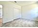 The bedroom features a tiled floor, baseboard trim and a double-door closet at 2645 Sw 155Th Ln, Ocala, FL 34473