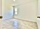 The bedroom features a tiled floor, baseboard trim and a double-hung window at 2645 Sw 155Th Ln, Ocala, FL 34473