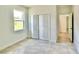 The bedroom features a tiled floor, baseboard trim and a double-door closet at 2645 Sw 155Th Ln, Ocala, FL 34473